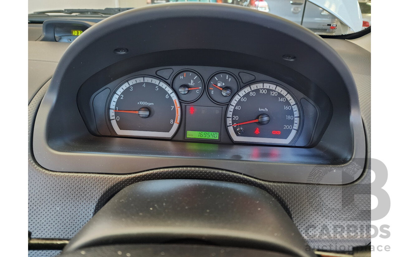 10/2011 Holden Barina  TK MY11 5d Hatchback White 1.6L